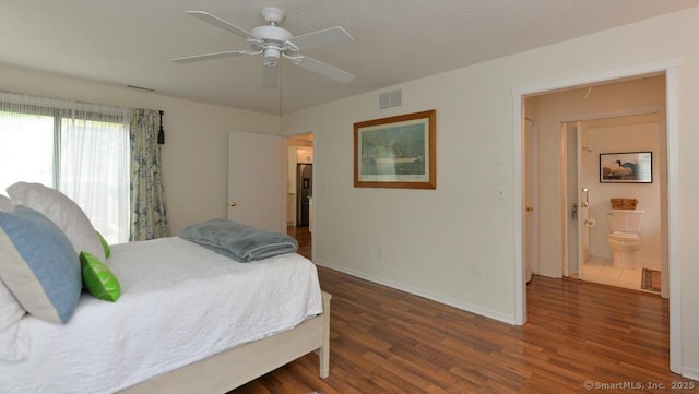 bedroom with wood finished floors, baseboards, and a ceiling fan