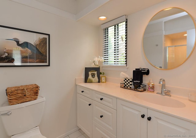 bathroom with vanity, toilet, a shower with door, recessed lighting, and tile patterned floors