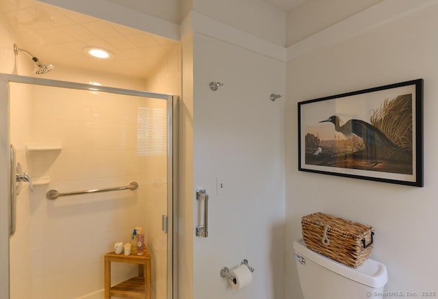 full bath featuring toilet and a shower stall