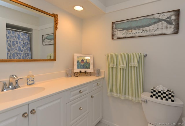 bathroom featuring vanity, toilet, recessed lighting, and a shower with shower curtain