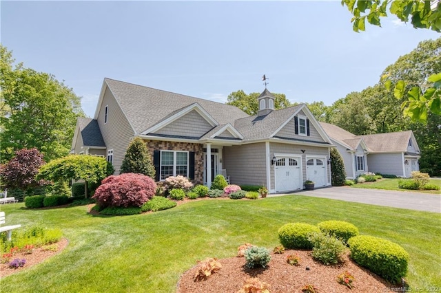 2 Crestview Dr Unit 2, Middlefield, CT 06481 - view of front facade featuring asphalt driveway, a front lawn, an attached garage, and stone siding
