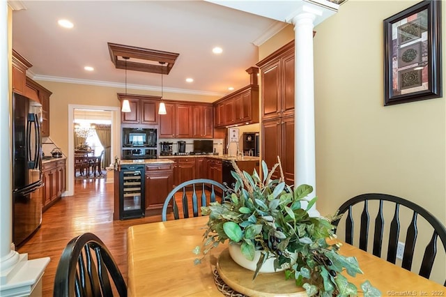 2 Crestview Dr Unit 2, Middlefield, CT 06481 - kitchen featuring wine cooler, fridge, black microwave, ornate columns, and wood finished floors
