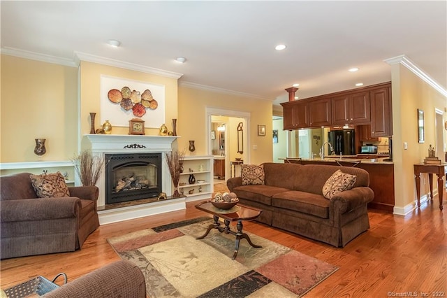 2 Crestview Dr Unit 2, Middlefield, CT 06481 - living room featuring ornamental molding, a fireplace with raised hearth, wood finished floors, and recessed lighting