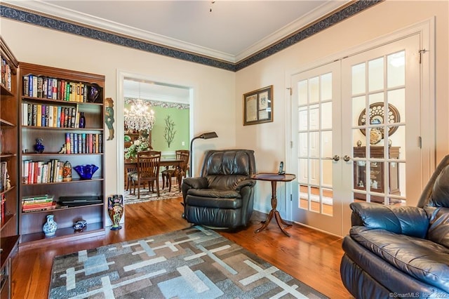 2 Crestview Dr Unit 2, Middlefield, CT 06481 - living area with a chandelier, wood finished floors, ornamental molding, and french doors