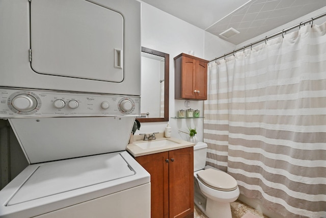 29 Van Buren Ave Apt L6, Norwalk, CT 06850 - full bathroom featuring estacked washer and dryer, toilet, vanity, and a shower with curtain