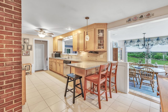 26 Williams Rd, Cheshire, CT 06410 - kitchen with appliances with stainless steel finishes, light tile patterned flooring, glass insert cabinets, and a breakfast bar