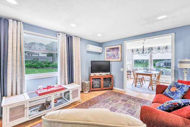 26 Williams Rd, Cheshire, CT 06410 - living area with a wall unit AC, a chandelier, wood finished floors, recessed lighting, and baseboards
