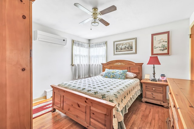 26 Williams Rd, Cheshire, CT 06410 - bedroom featuring a wall mounted air conditioner, light wood-style flooring, and a ceiling fan