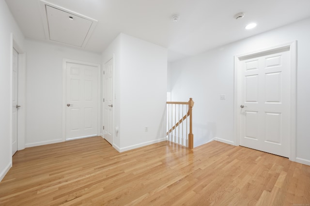 65 Macarthur Ln Apt 6, Stamford, CT 06902 - spare room featuring light wood-style floors, attic access, baseboards, a smoke detector, and recessed lighting