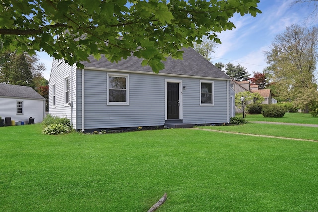 5 Roberge Rd, Bristol, CT 06010 - view of front of house featuring a front yard and a shingled roof