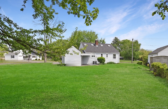 5 Roberge Rd, Bristol, CT 06010 - view of grassy yard featuring central air condition unit