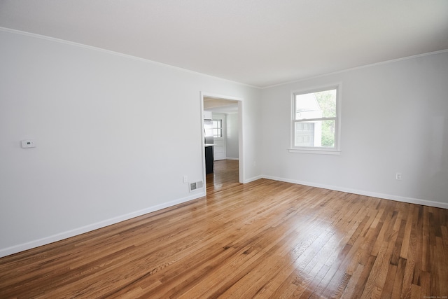 5 Roberge Rd, Bristol, CT 06010 - unfurnished room with healthy amount of natural light, hardwood / wood-style flooring, crown molding, and baseboards