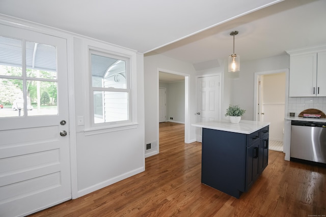 5 Roberge Rd, Bristol, CT 06010 - kitchen with dishwasher, light countertops, pendant lighting, wood finished floors, and a kitchen island
