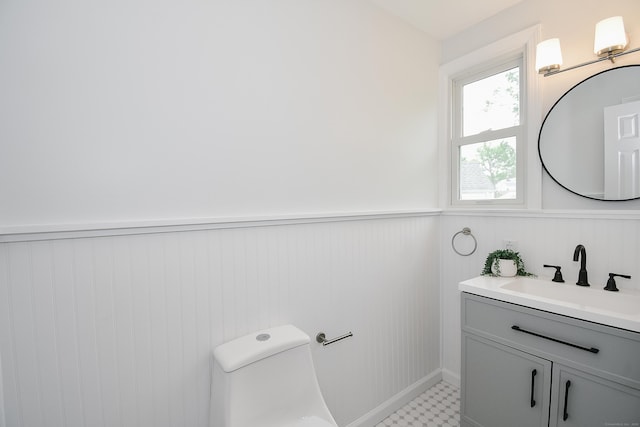 5 Roberge Rd, Bristol, CT 06010 - bathroom featuring a wainscoted wall, vanity, and toilet