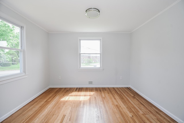 5 Roberge Rd, Bristol, CT 06010 - unfurnished room with healthy amount of natural light, light wood-style floors, baseboards, and crown molding