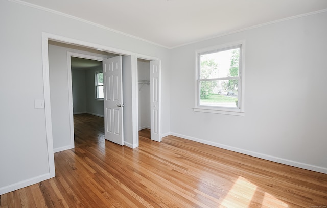 5 Roberge Rd, Bristol, CT 06010 - unfurnished bedroom featuring light wood-style floors, baseboards, ornamental molding, and a closet