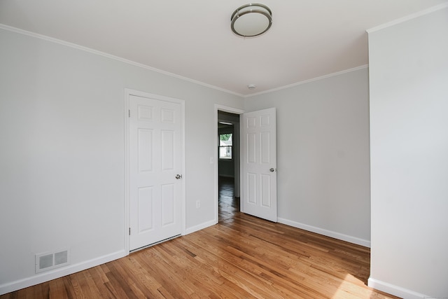 5 Roberge Rd, Bristol, CT 06010 - unfurnished bedroom with light wood-type flooring, baseboards, and crown molding