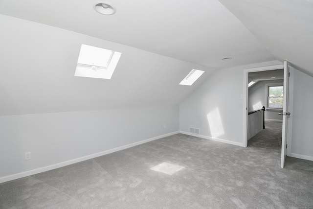 5 Roberge Rd, Bristol, CT 06010 - bonus room featuring a skylight, lofted ceiling, carpet, and baseboards