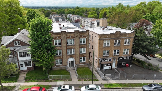 view of building exterior with fence