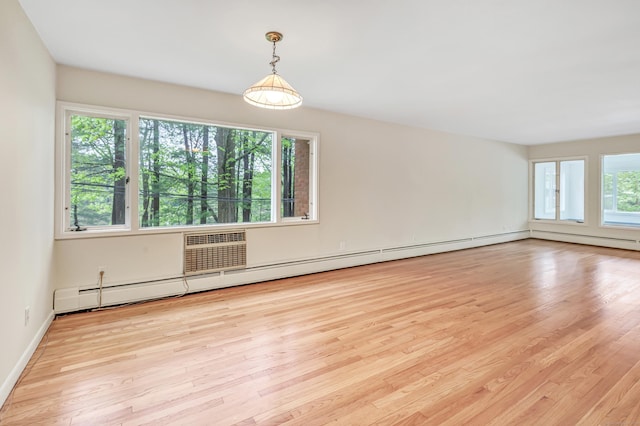 42 N Lake Dr Apt C2, Hamden, CT 06517 - spare room with wood finished floors, baseboard heating, and baseboards
