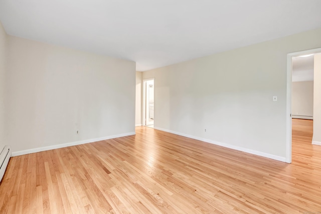 42 N Lake Dr Apt C2, Hamden, CT 06517 - unfurnished room with baseboard heating, light wood-style floors, and baseboards