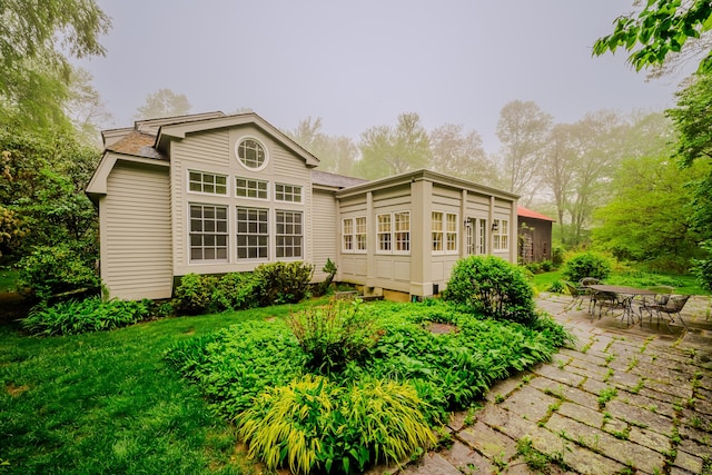 back of house featuring a patio