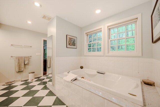 full bath featuring a garden tub and recessed lighting