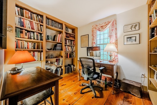 office space with hardwood / wood-style floors