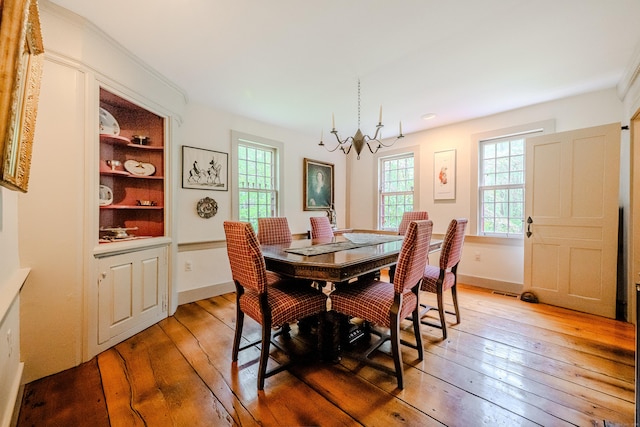 dining room with a chandelier, light wood-style flooring, healthy amount of natural light, baseboards, and recessed lighting