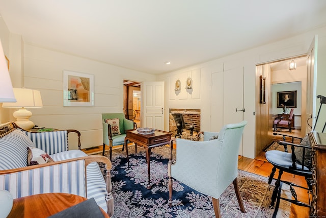 living room featuring wood finished floors and a fireplace