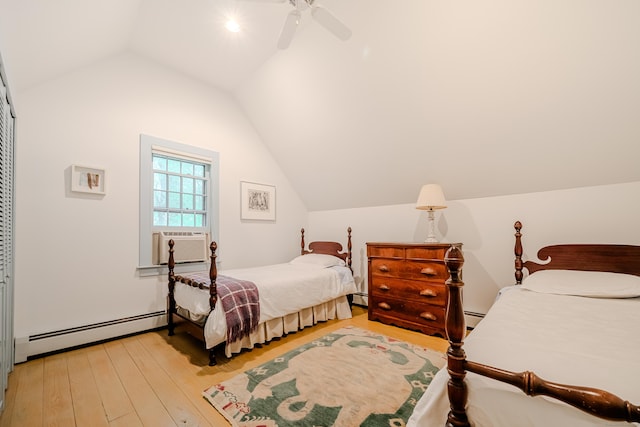 bedroom featuring a baseboard heating unit, vaulted ceiling, cooling unit, light wood-type flooring, and baseboard heating