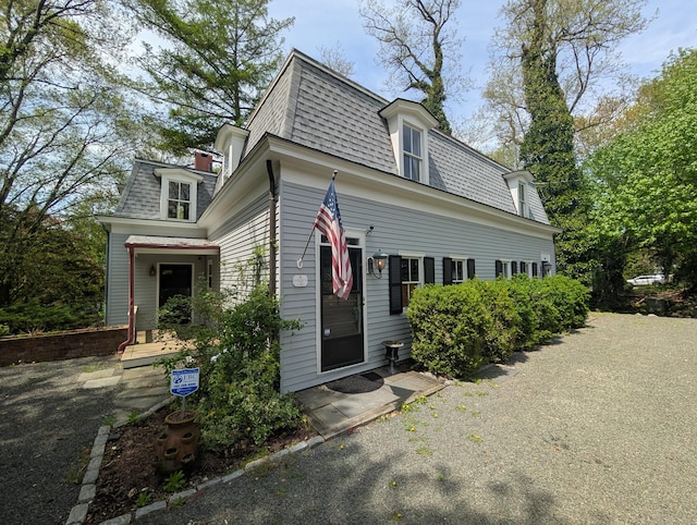 47 Hollow Tree Ridge Rd, Darien, CT 06820 - victorian home with mansard roof and a shingled roof