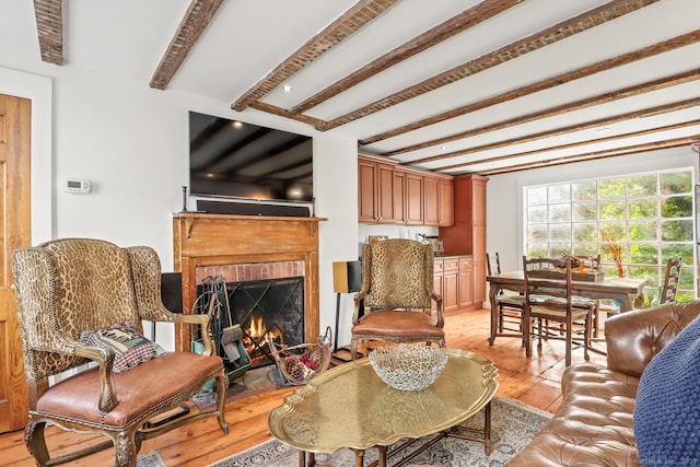 47 Hollow Tree Ridge Rd, Darien, CT 06820 - living room with beam ceiling, light wood-style floors, and a brick fireplace