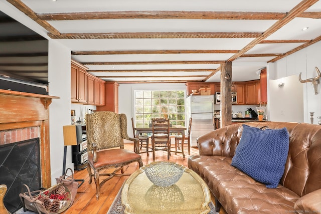 47 Hollow Tree Ridge Rd, Darien, CT 06820 - living area featuring hardwood / wood-style floors, beamed ceiling, and a fireplace