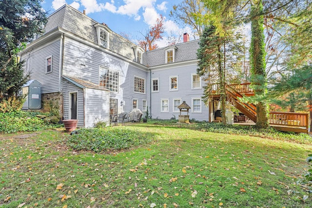 47 Hollow Tree Ridge Rd, Darien, CT 06820 - back of house featuring mansard roof, a yard, a deck, and a chimney