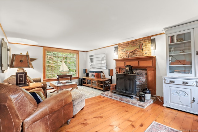 47 Hollow Tree Ridge Rd, Darien, CT 06820 - living area with hardwood / wood-style flooring, ornamental molding, and a wood stove