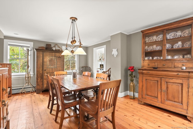 47 Hollow Tree Ridge Rd, Darien, CT 06820 - dining room featuring a baseboard heating unit, ornamental molding, light wood-style flooring, and baseboards