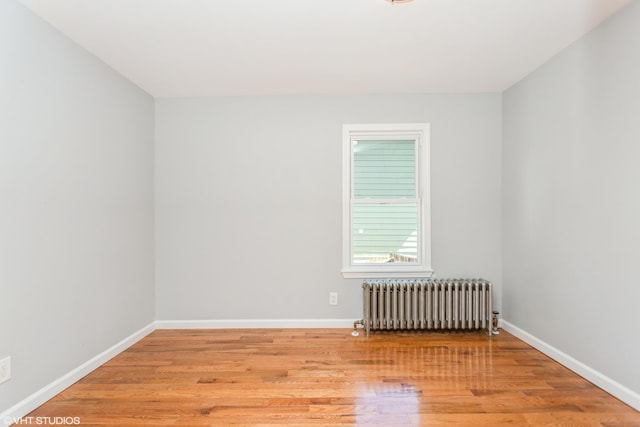 70 Maple St, Meriden, CT 06451 - unfurnished room with radiator heating unit, light wood-style flooring, and baseboards