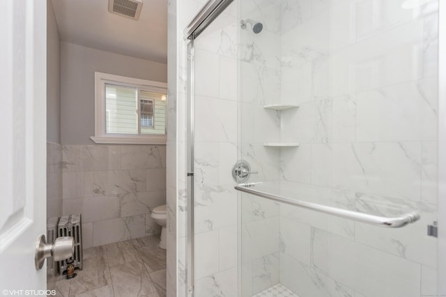 70 Maple St, Meriden, CT 06451 - full bath with radiator, a shower stall, toilet, tile walls, and marble finish floors