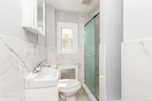 70 Maple St, Meriden, CT 06451 - full bathroom with toilet, a shower stall, tile walls, and vanity