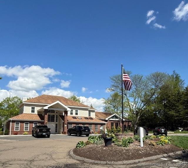 202 Carriage Crossing Ln Unit 202, Middletown, CT 06457 - view of front of house with uncovered parking and brick siding