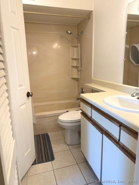 202 Carriage Crossing Ln Unit 202, Middletown, CT 06457 - bathroom featuring tile patterned floors,  shower combination, vanity, and toilet