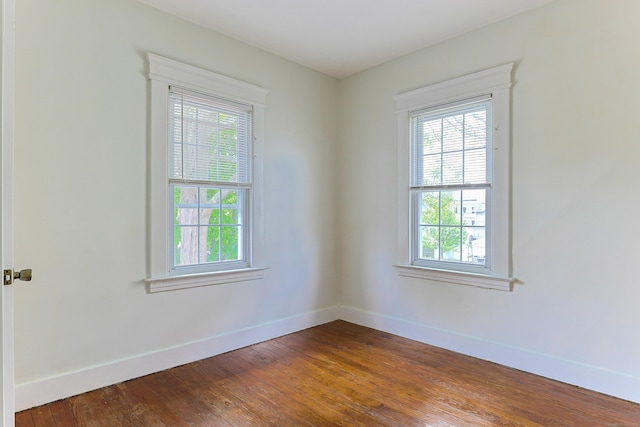 262 Blohm St, West Haven, CT 06516 - unfurnished room featuring healthy amount of natural light, baseboards, and dark wood-style flooring