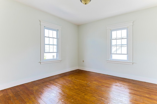 262 Blohm St, West Haven, CT 06516 - unfurnished room with plenty of natural light, hardwood / wood-style floors, and baseboards