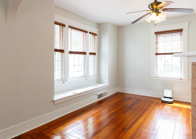 262 Blohm St, West Haven, CT 06516 - empty room featuring healthy amount of natural light, ceiling fan, baseboards, and hardwood / wood-style floors
