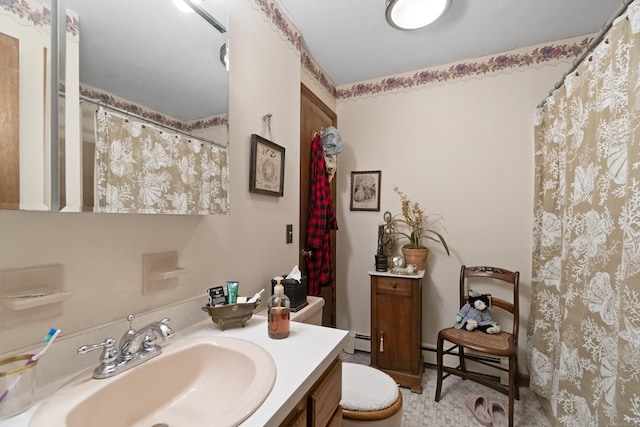 full bath featuring a baseboard heating unit, vanity, and curtained shower