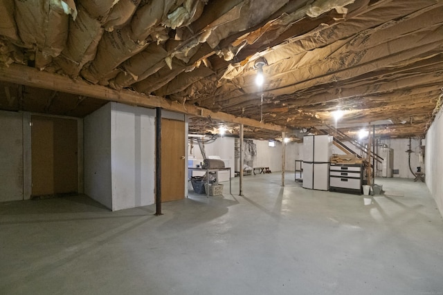 unfinished basement with water heater