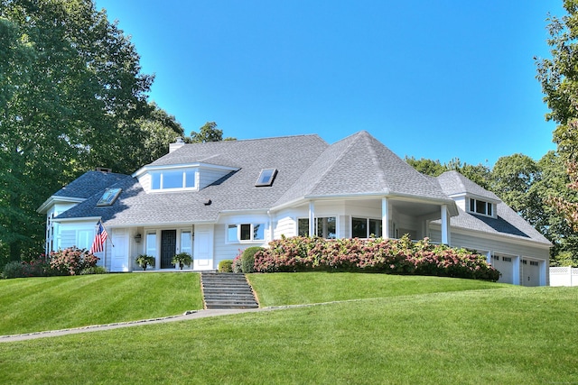 63 Balfour Dr, West Hartford, CT 06117 - view of front of home featuring a front lawn, an attached garage, a chimney, and roof with shingles