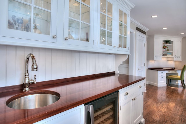 63 Balfour Dr, West Hartford, CT 06117 - bar area featuring a sink, wine cooler, dark wood finished floors, recessed lighting, and backsplash
