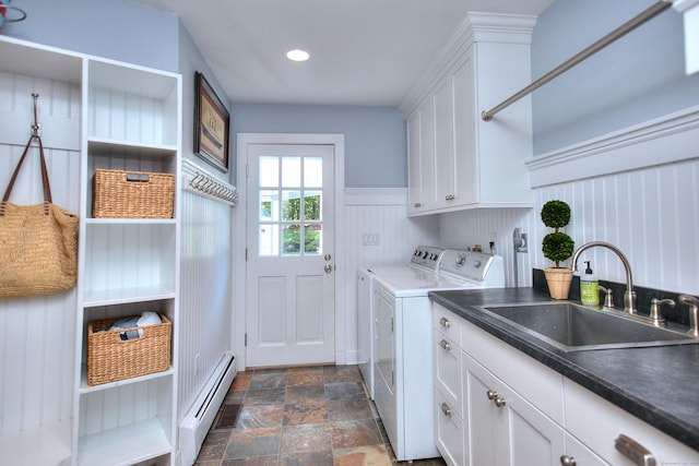 63 Balfour Dr, West Hartford, CT 06117 - laundry area featuring baseboard heating, separate washer and dryer, cabinet space, dark stone finish floors, and a wainscoted wall